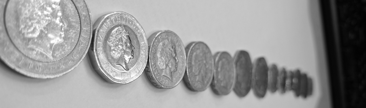 Security officer of tomorrow - Coins lined up to the amount of the current minimum wage as of 2017 - £7.50